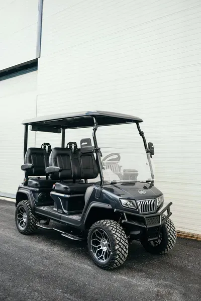 Luxury Electric’s Carrier 8 Plus white golf cart powered by a lithium-ion battery, offering long-lasting performance and efficiency.