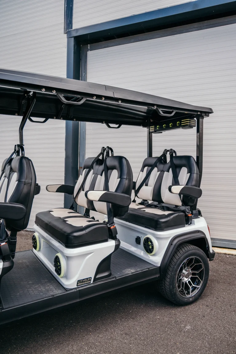 Enjoy the Top Benefits of Using Luxury Golf Carts; this 8-seater model transports large groups with comfort and style.