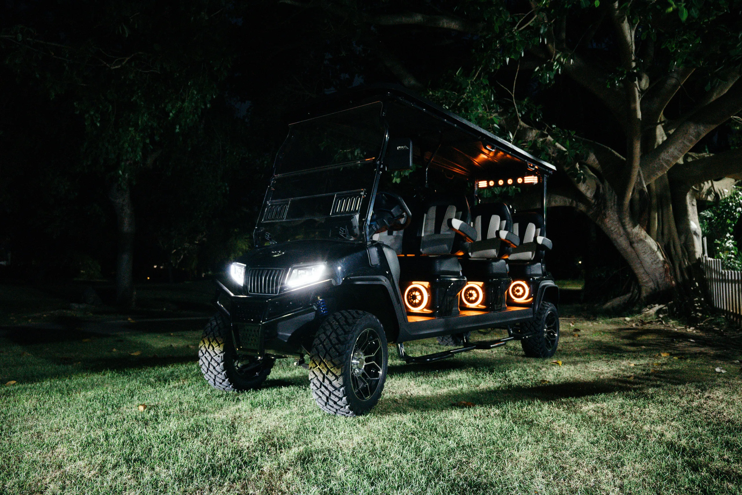 This image shows the Top Benefits of Using Luxury Golf Carts with spacious seating and custom lights, perfect for group transport.