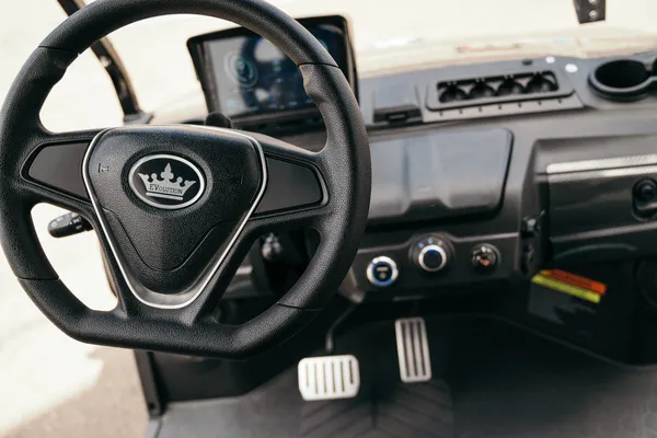 Close-up of the steering wheel and pedals: Advantages of choosing an electric golf cart over a gasoline one